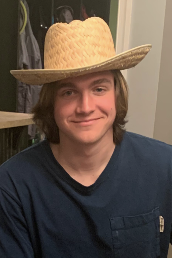 Lukas in a straw hat
