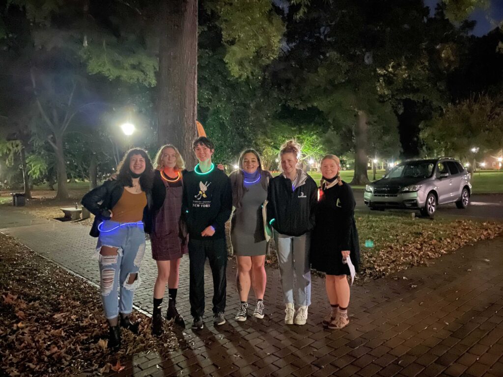 Students on Ghost Story Tour with glow sticks around their necks