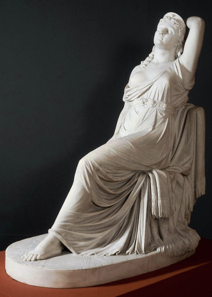 Stone and marble statue of Cleopatra on her deathbed, with her arm raised above her head
