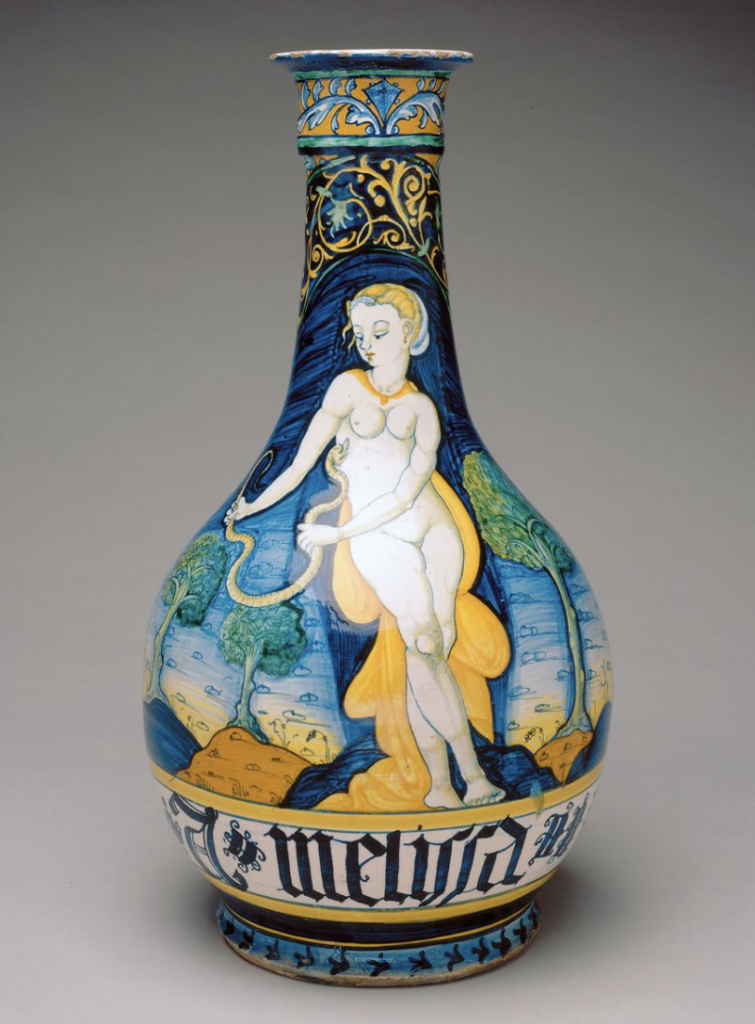 A blue and yellow bottle that depicts Cleopatra's suicide with a snake
