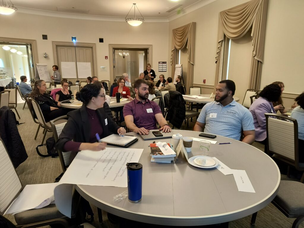 Participants discussing around a table