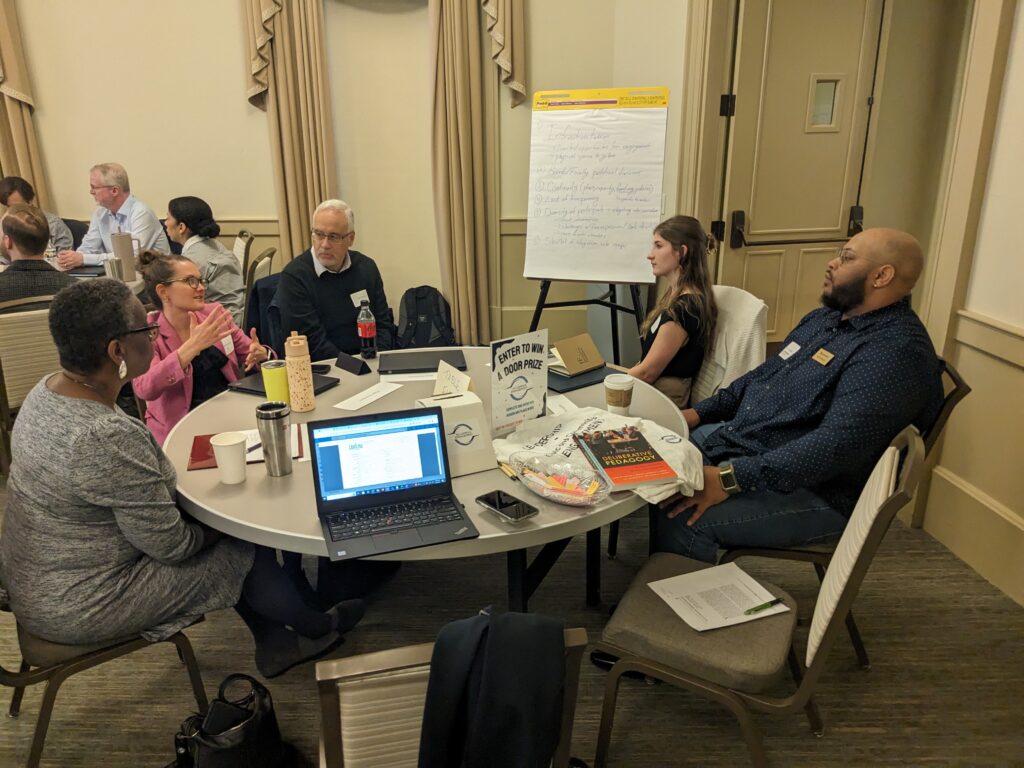 Participants discussing around a table