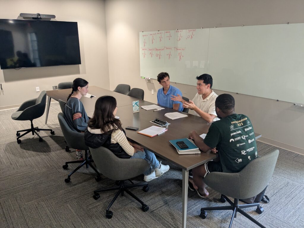 photo of participants in a small group conversation