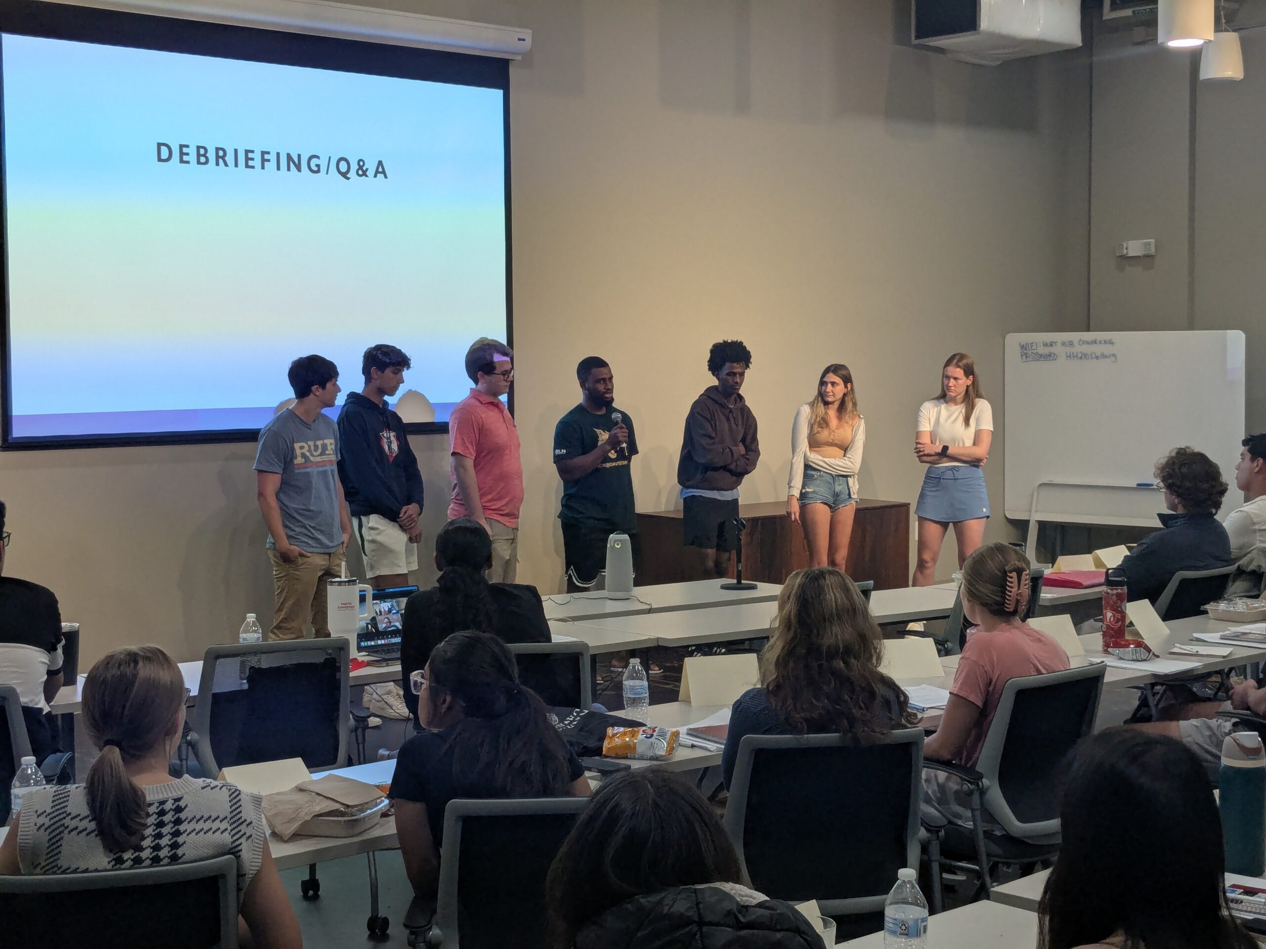 Photo of senior fellows answering questions at training