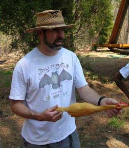 Man with rubber chicken