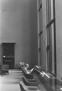 a student studying in front of the windows