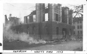 Watts dormitory building after the fire, all that is left is the first floor and part of the second with smoke still coming from it.