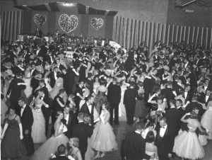 Mid-winters dance, a few hundred men in coats and ties, women in dresses and long sleeve gloves, dancing