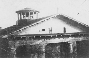 Chambers building with students exploring the portico and roof