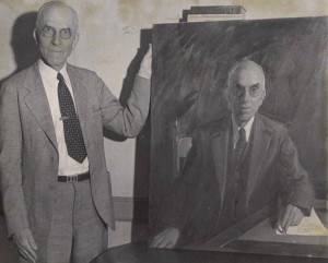 Dean Mark E. Sentelle with his portrait.