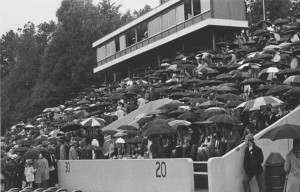 Homecoming 1969, the football stands filled with fans holding umbrellas