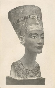 Front of postcard - an egyptian statue of a head with a traditional nefertiti