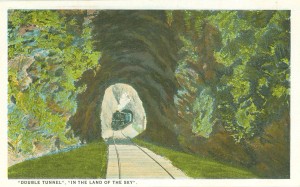 A tunnel in the Blue Ridge captioned, ""DOUBLE TUNNEL", "IN THE LAND OF THE SKY"."