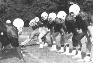 Football practice, players lined up in punt formation