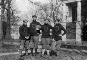 Football practice on the grass between Phi and Eu Halls, c1900