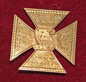 A Eumenean Society badge, which belonged to Joel Mable (class of 1864)