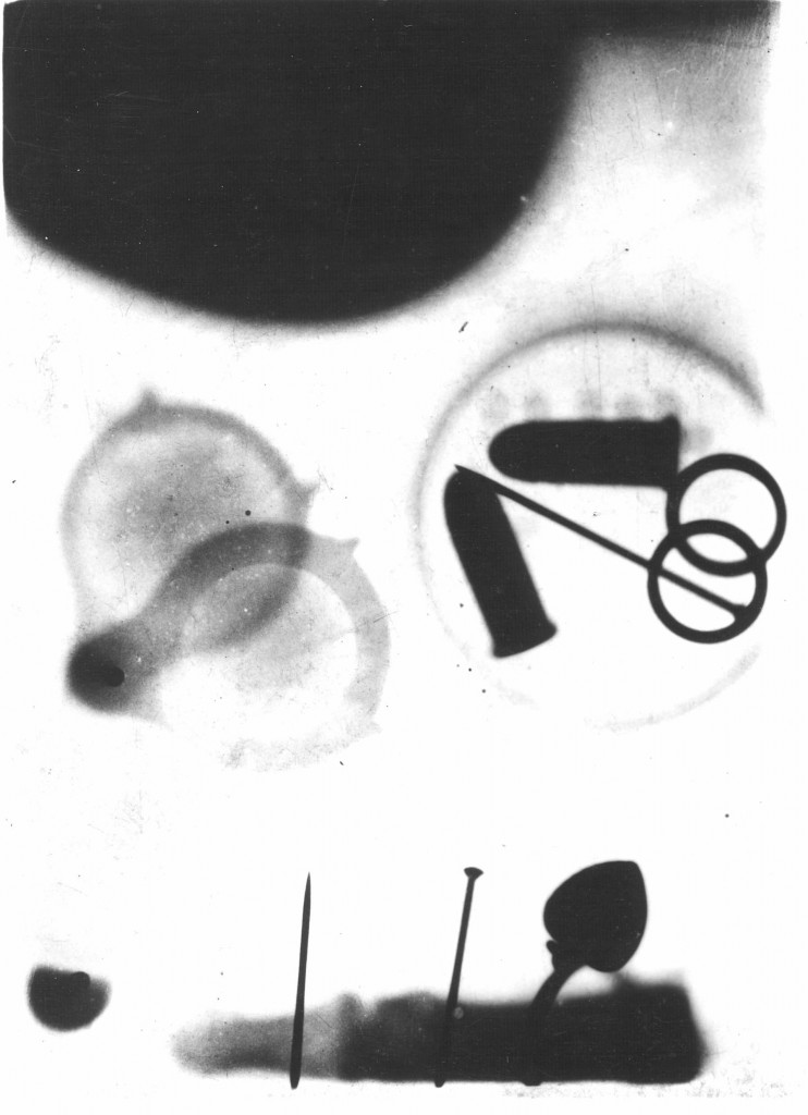 Eben Hardin, Pender Porter, and Osmond L. Barringer snuck into Dr. Henry Louis Smith's lab to X-Ray: a cadaver finger wearing a ring and stuck with two pins; magnifying glass; a pill box containing two 22 cartridges, one pin, two rings, and six Strychnine pills; and an empty egg with a button inside.