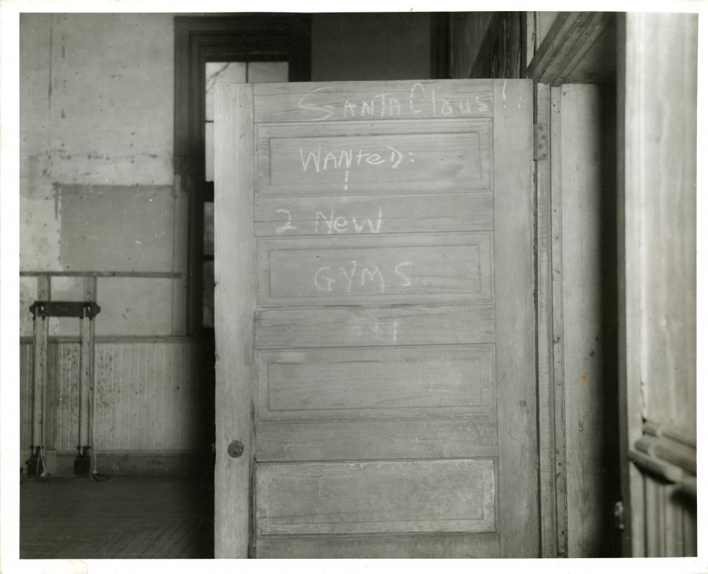 A message to Santa, written on a door inside of Alumni Gymnasium (built 1916, remodeled into the Ovens Student Union in 1952, and demolished in 1972 to make space for E.H. Little Library).