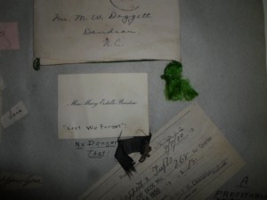 Ribbons adorning invitations in Marshall Doggett's (1922) scrapbook.