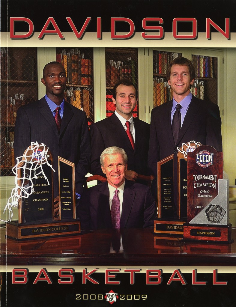 The cover of the 2008 - 2009 basketball media guide, taken in E.H. Little's own Smith Rare Book Room. McKillop is pictured with a few of his SoCon tournament trophies and with then-seniors Andrew Lovedale, Can Civi, and Max Paulhus Gosselin. 