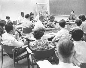 Alumni here are listening to Ed White in a classroom