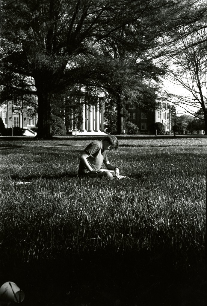 David Johnston (Class of 1990) studies in the grass in front of Chambers Building. Photo by Lucy Silver (Class of 1991).