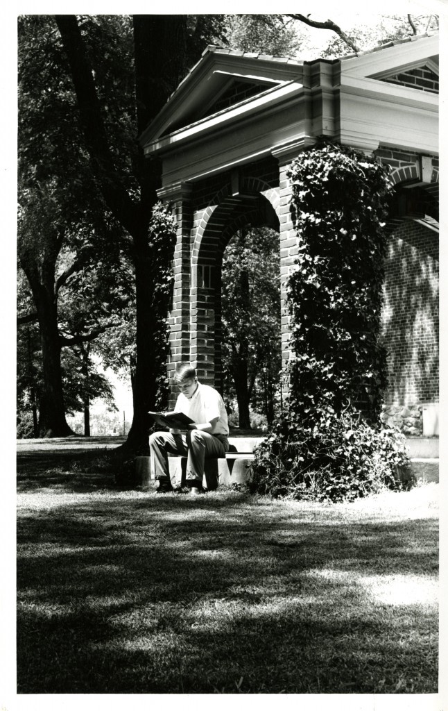 A student studies on the steps of the Old Well.