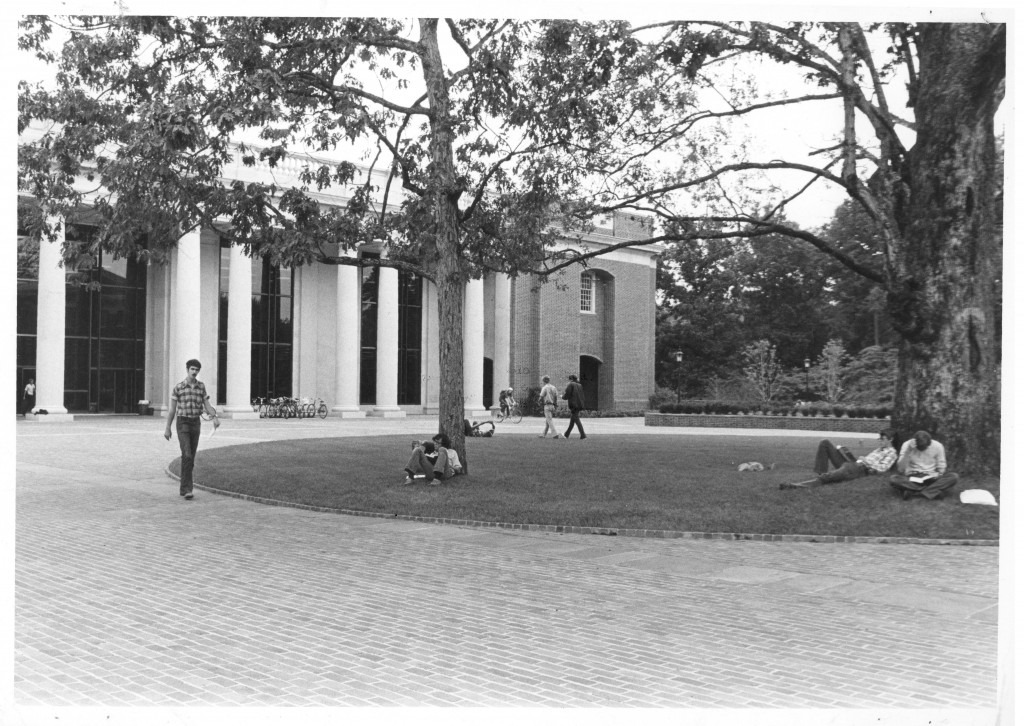 Students study on Richardson Plaza, between E.H. Little Library and Chambers Building, 1975.