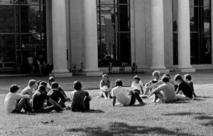 Ziegler and students in an outdoor class session in the front of E.H. Little Library - perhaps discussing the English countryside of Austen