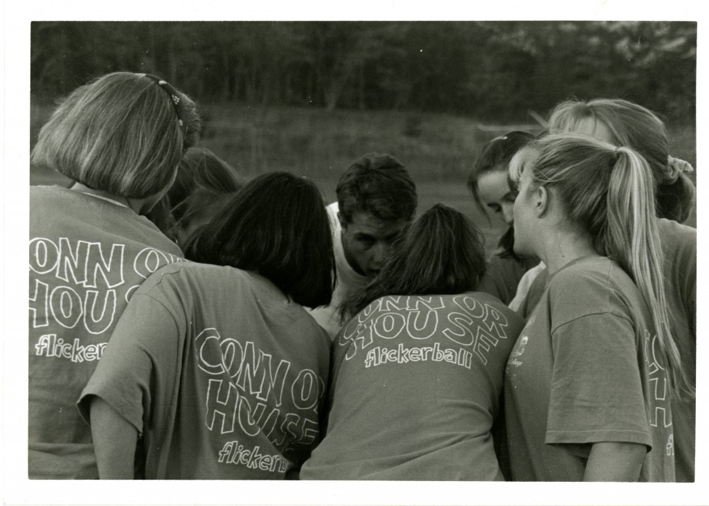 Connor House, one of the college eating houses, fields a team for the 1995 flickerball season. The team is in a huddle, they are all wearing "Connor House flickerball" shirts