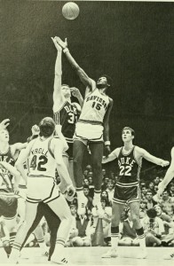 A jump ball between Davidson and Duke at a basketball game