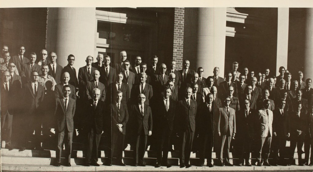 Davidson faculty in 1966 all dressed in suits standing on the chambers' stairs