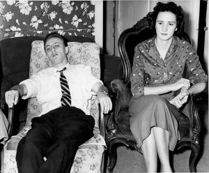 Photo of two of the Hocsaks sitting in chairs looking tired taken shortly after their arrival in 1957