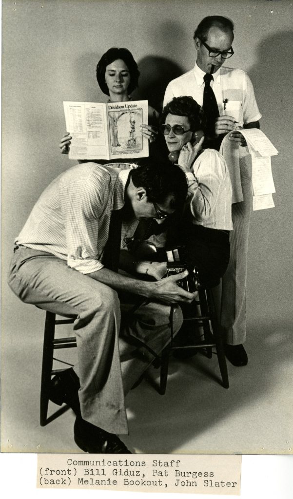 Undated (circa early 1980s) image of College Communications staff. Bill Giduz is in the front, and Melanie Bookout, John Slater, and Pat Burgess are in the back.