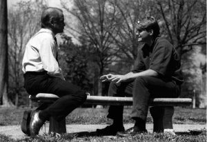 Tom Shandley with SGA President Warren Buford on a bench outside