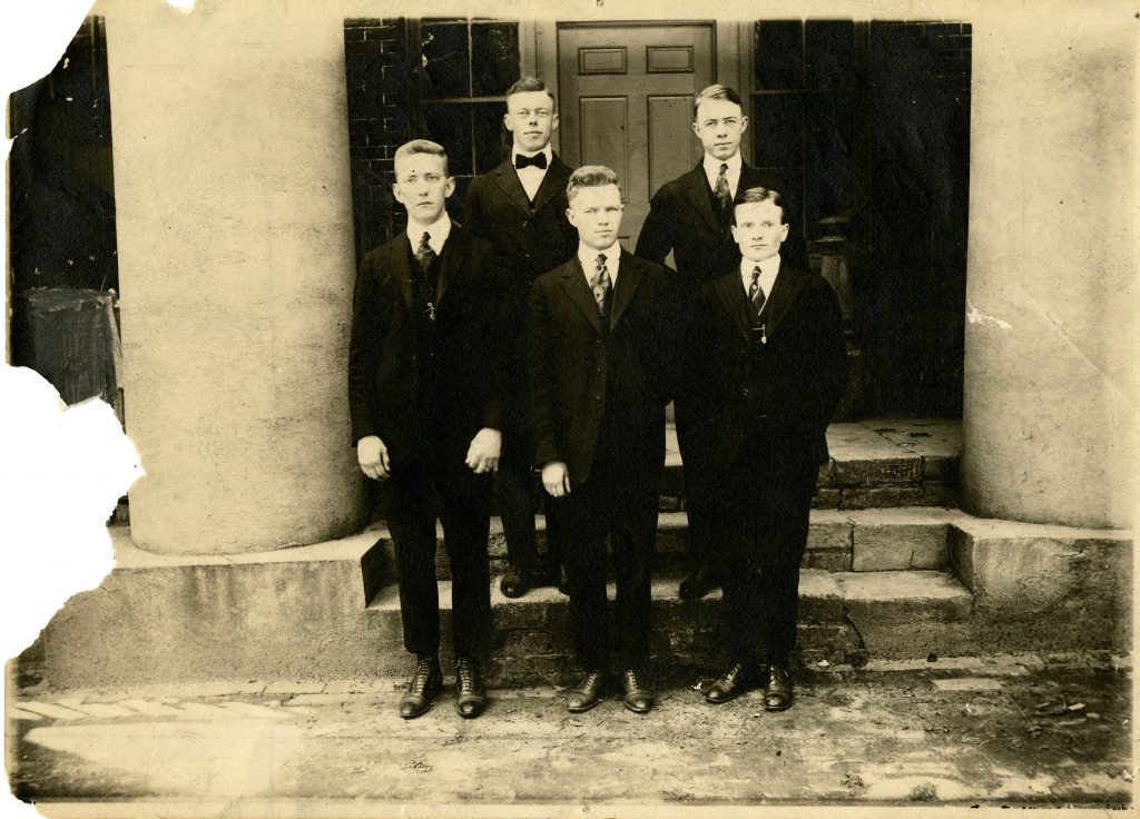 The 1917-1918 debate teams, standing on the steps of Old Chambers. These student teams won debates with Lafayette College and Roanoke College.