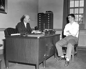 Bailey in 1949 with a student. It is not clear if any of this books on his desk is a "Doom Book of Absences."