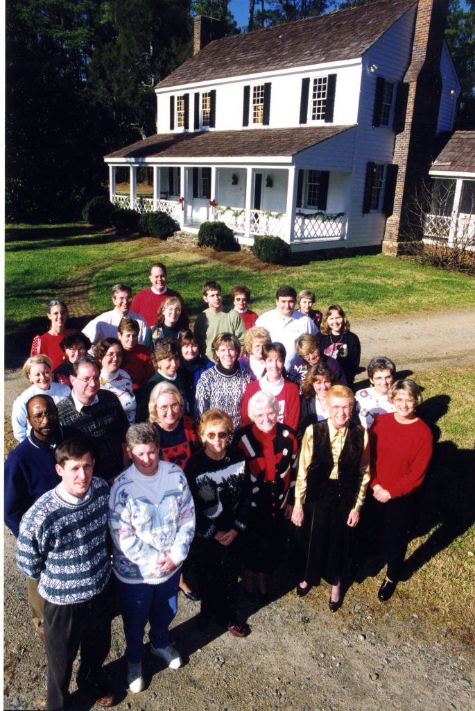 Library staff gather in front of Beaver Dam in 1999. Jan is towards the back of the group.