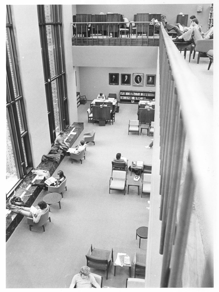 Students study on the upper and lower levels of E.H. Little Library, 1977.