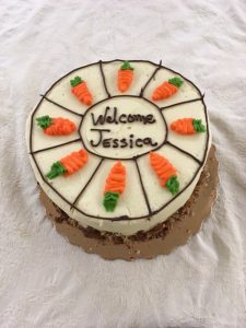 Jessica Cottle's Welcome Cake. Carrot cake with 8 icing carrots on the top with, "Welcom Jessica" written on the top as well.