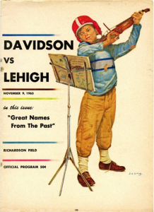 A boy wearing a football helmet playing a violin. Davidson vs. Lehigh. Richardson Field. November 9, 1953.