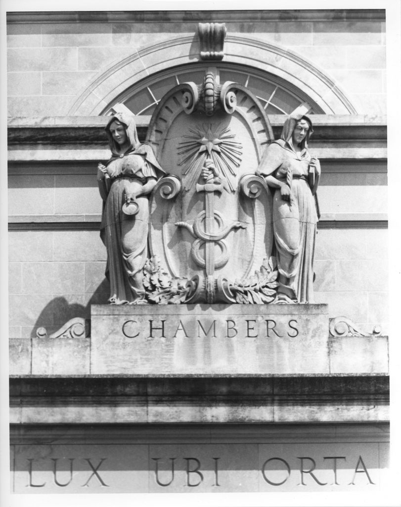 B/W image of two statues on the top of Chambersg