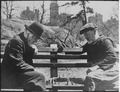 Two old men playing chess on a Central Park bench, 1946.