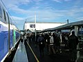 Ambiance sur les quais entre les rames de TGV Duplex Dasye numéro 746 (à gauche) et Euroduplex (2N2) numéro 4703 (à droite) en gare de Belfort - Montbéliard TGV. Au loin, le bâtiment voyageurs