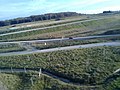 Paysage le long de la LGV Rhin-Rhône, sur le territoire de la commune de Trévenans, pris depuis le TGV Euroduplex (2N2) numéro 4703 voyageant entre les gares de Belfort - Montbéliard TGV et de Besançon Franche-Comté TGV