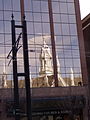 The Assembly Hall mirrored in the windows of a nearby building
